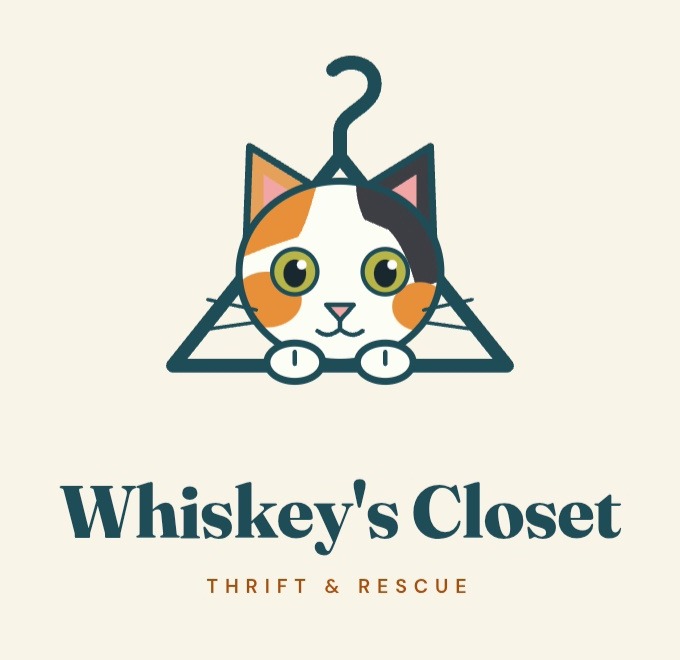 Whiskey's Closet Thrift and Rescue logo: a calico cat peeking through a clothes hanger